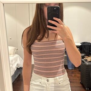 Light pink bodysuit.‎ Gold sparkly stripe. Spaghetti strap.